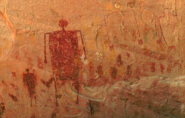 Red anthropomorphs and hand prints, Painted cave, 236 x 370 pixels, 35 K.