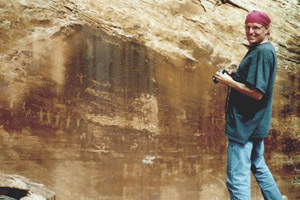 Jim Jacobs at rock art site in Utah.